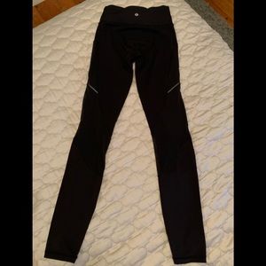Black Lulu Lemon leggings with mesh sides